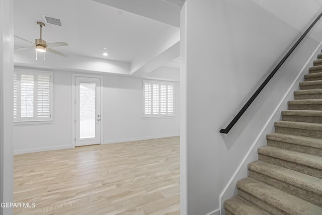 entryway with ceiling fan and light wood-type flooring