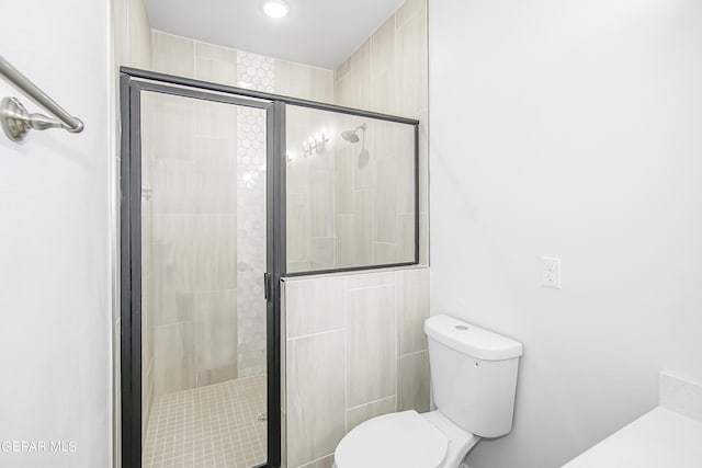 bathroom with toilet and walk in shower