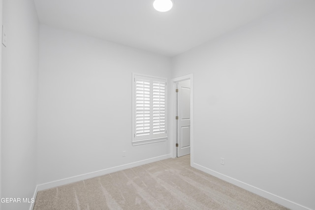 empty room with light colored carpet