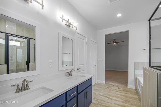 bathroom with ceiling fan, vanity, and independent shower and bath