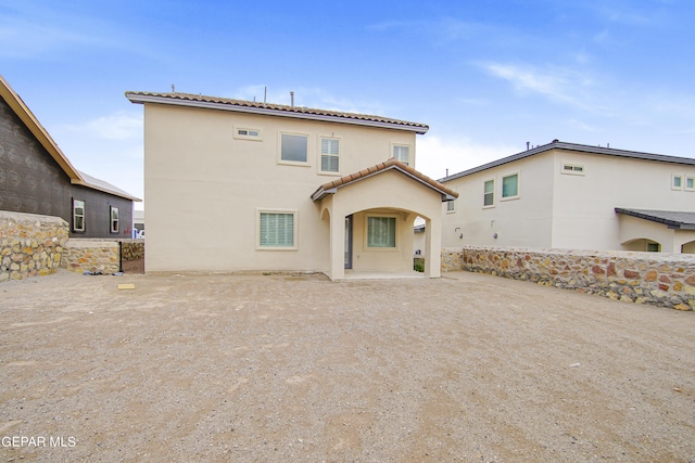 back of house featuring a patio