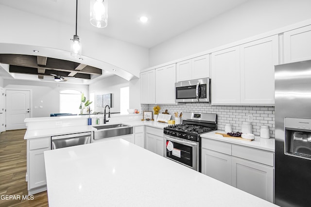 kitchen featuring sink, stainless steel appliances, and white cabinets