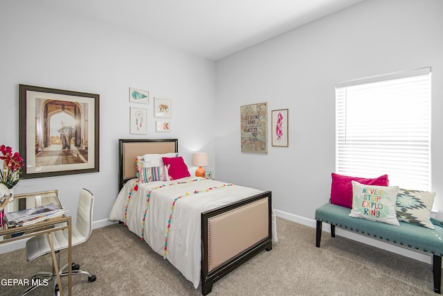 bedroom featuring light carpet