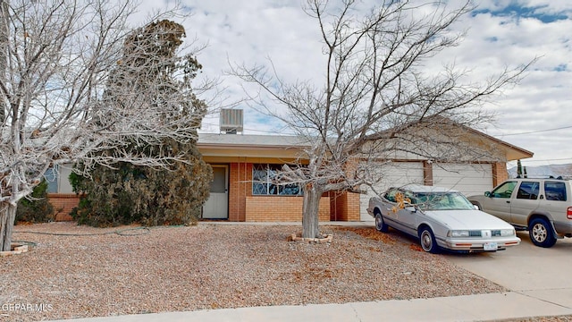 single story home featuring a garage