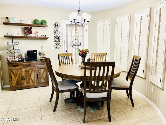 dining space with a notable chandelier and light tile patterned flooring