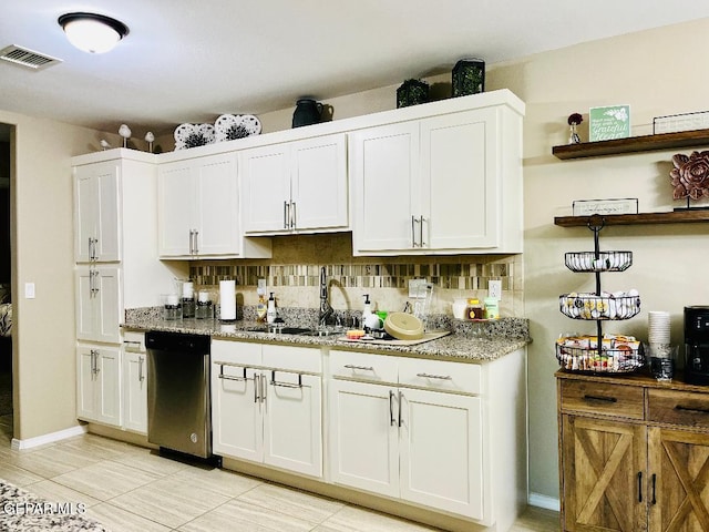 kitchen featuring white cabinetry, tasteful backsplash, and dishwashing machine