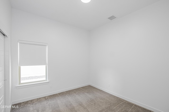 unfurnished room featuring carpet flooring