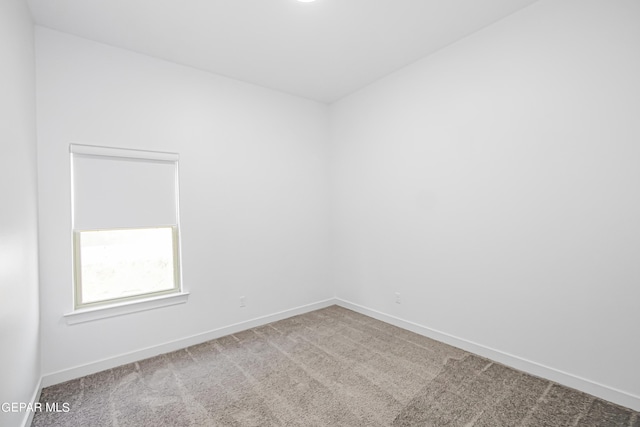 empty room with carpet flooring