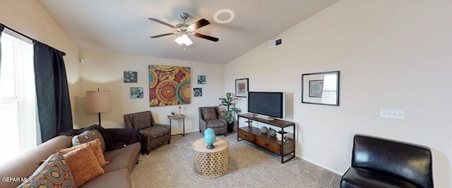 living room featuring lofted ceiling, light colored carpet, and ceiling fan