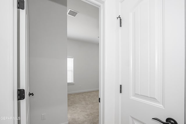 hallway with light carpet