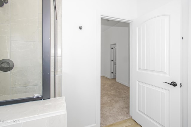 bathroom featuring tiled shower