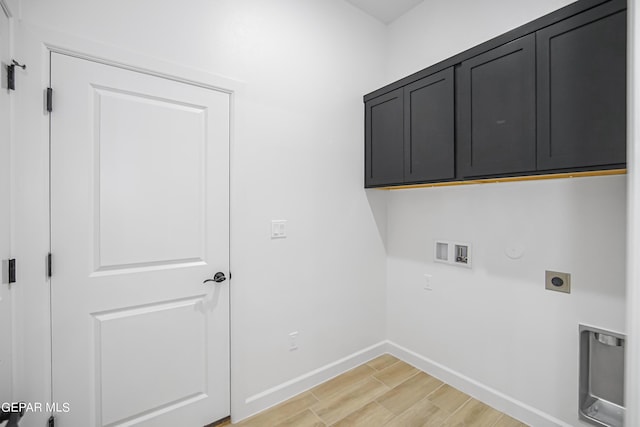 washroom with cabinets, electric dryer hookup, washer hookup, hookup for a gas dryer, and light hardwood / wood-style floors