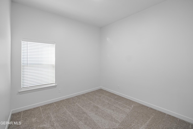 unfurnished room with carpet floors