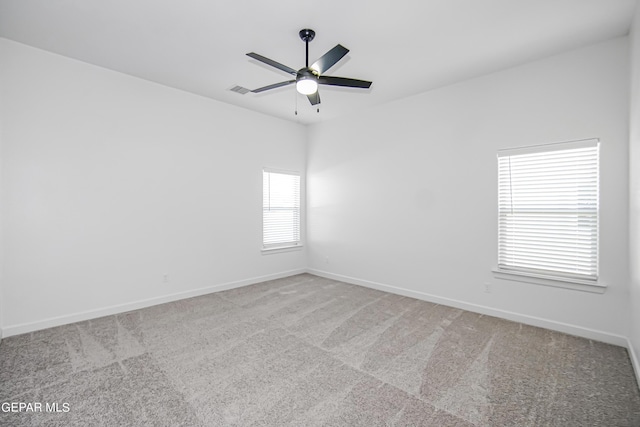 unfurnished room with carpet and ceiling fan