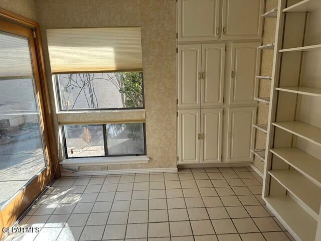 interior space featuring light tile patterned floors