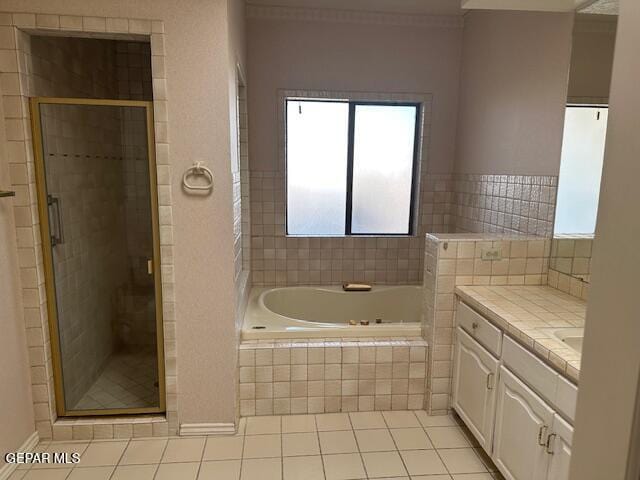 bathroom with vanity, separate shower and tub, and tile patterned flooring