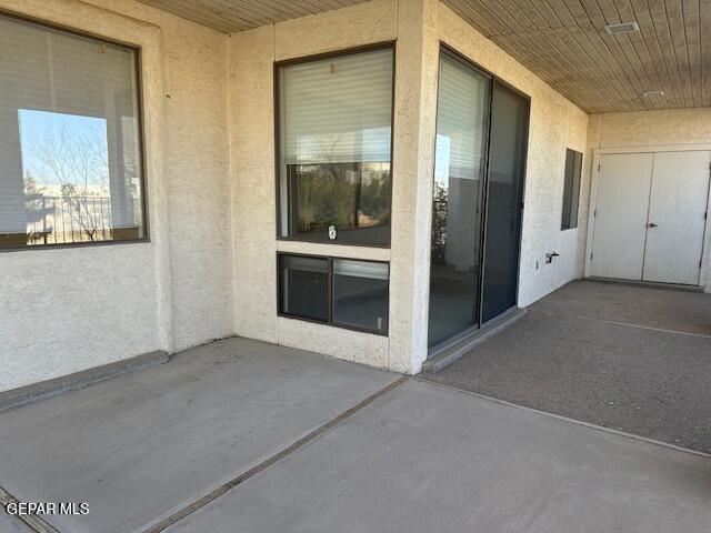 property entrance with a patio area