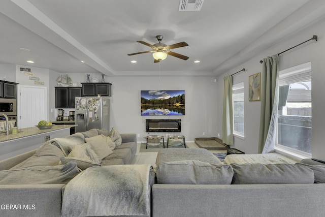 living room with ceiling fan