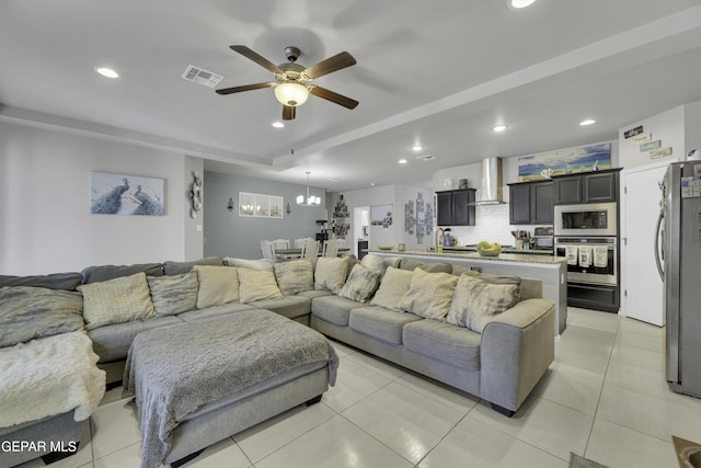 tiled living room featuring ceiling fan