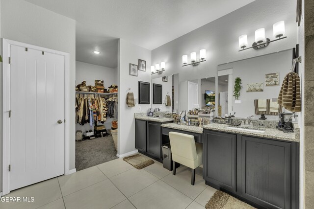 bathroom with tile patterned flooring and vanity