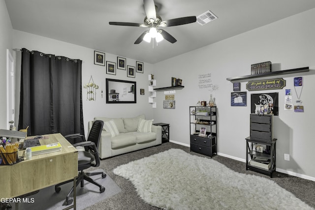 home office with ceiling fan and carpet