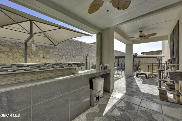 view of patio / terrace featuring ceiling fan