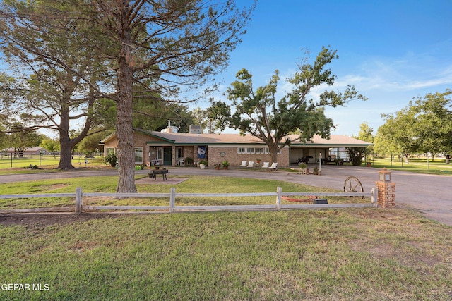 ranch-style house with a front lawn