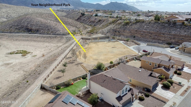 birds eye view of property with a mountain view