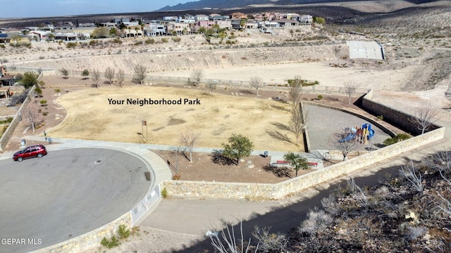 birds eye view of property with a mountain view