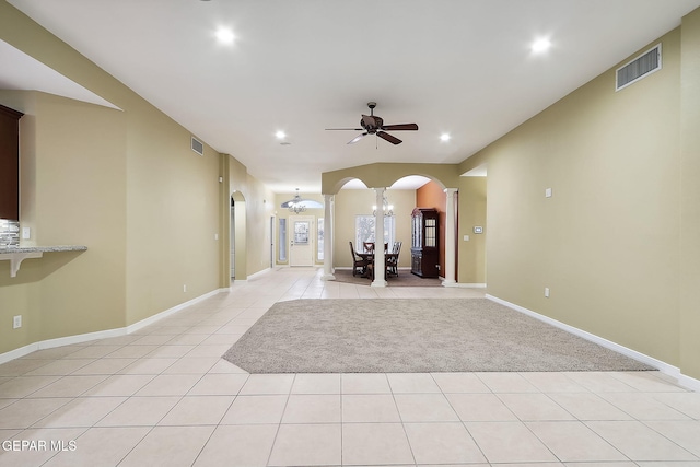 interior space with ceiling fan with notable chandelier