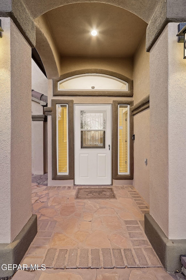 doorway to property with a patio area