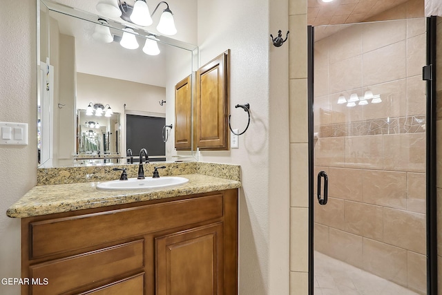 bathroom featuring an enclosed shower and vanity