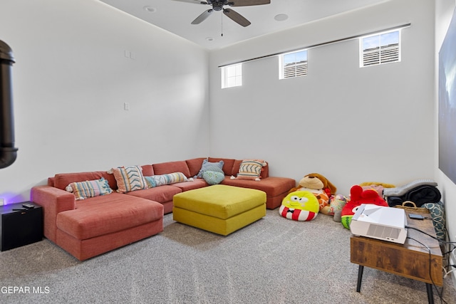 rec room featuring ceiling fan and carpet