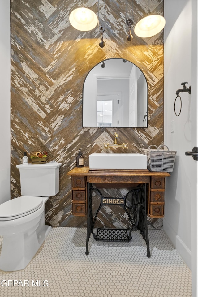 bathroom featuring tile patterned floors, vanity, and toilet