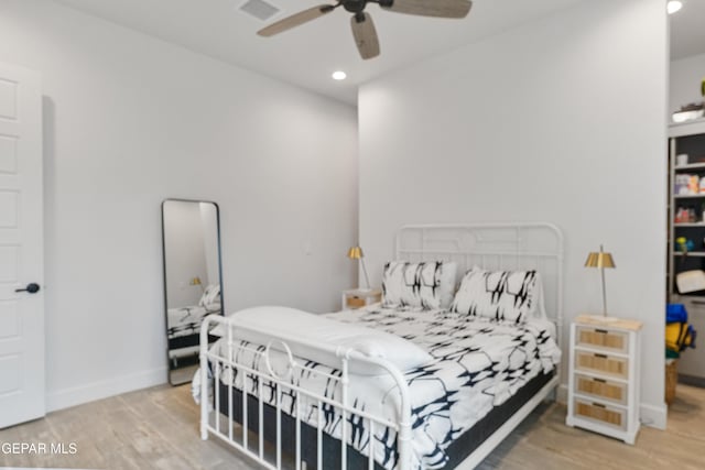 bedroom featuring ceiling fan and light hardwood / wood-style flooring