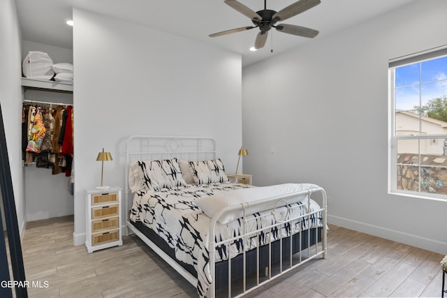 bedroom featuring ceiling fan and hardwood / wood-style flooring