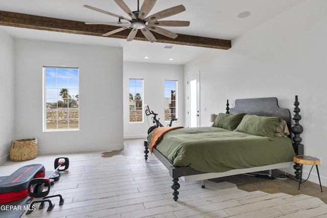 bedroom featuring beamed ceiling and ceiling fan