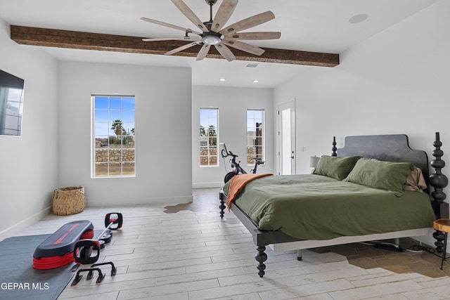 bedroom featuring ceiling fan, light hardwood / wood-style floors, and beamed ceiling