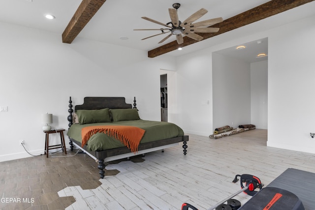 bedroom with ceiling fan, wood-type flooring, and beamed ceiling