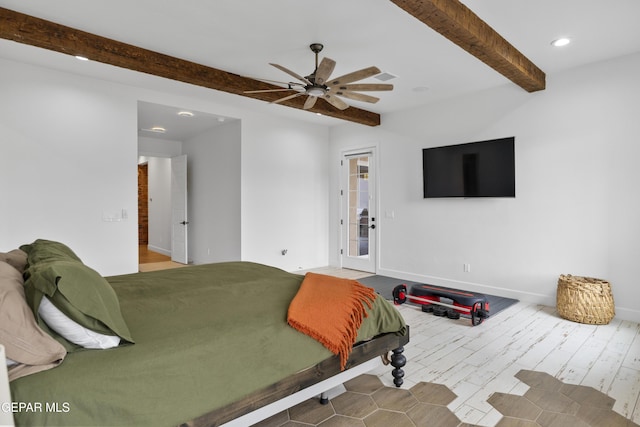 bedroom featuring ceiling fan, beam ceiling, and hardwood / wood-style floors