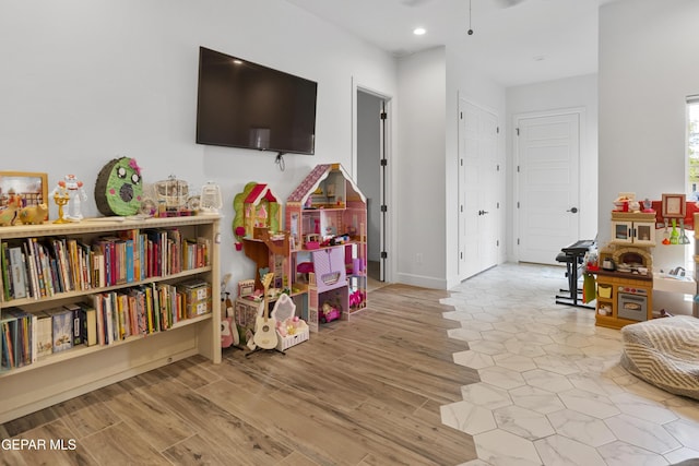 recreation room featuring light hardwood / wood-style flooring