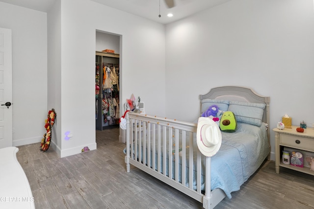 bedroom with hardwood / wood-style flooring and ceiling fan