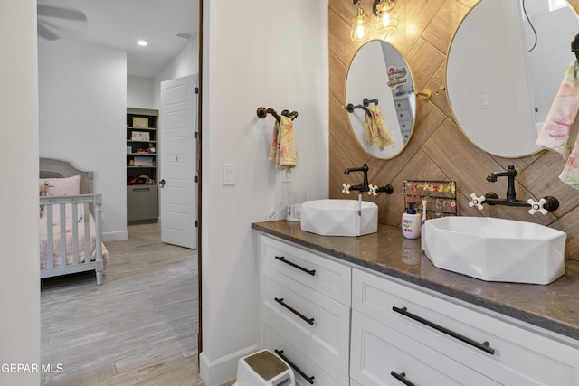 bathroom featuring vanity and wood-type flooring