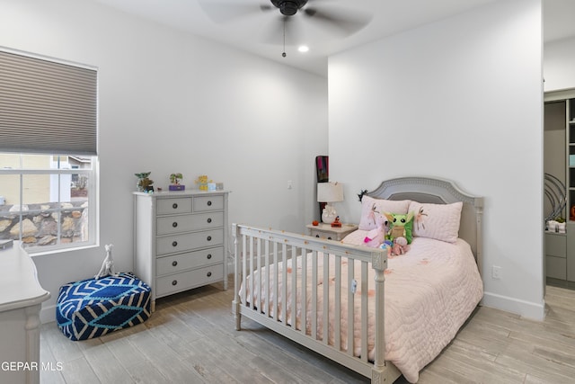 bedroom featuring ceiling fan and light hardwood / wood-style floors