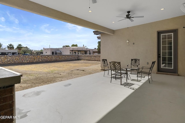 view of patio featuring ceiling fan