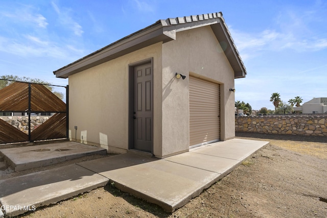 view of outbuilding with a garage