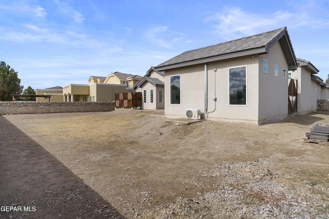 back of property with ac unit