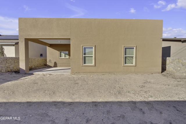 rear view of house featuring a patio