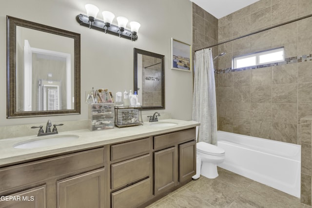 full bathroom with toilet, shower / tub combo, and vanity