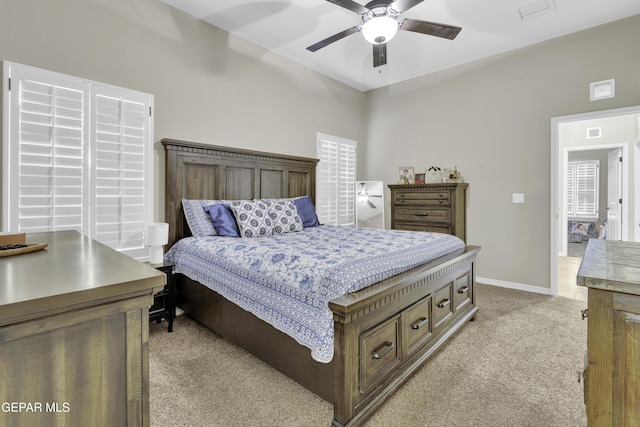 bedroom with light carpet and ceiling fan